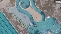 aerial view over a pool and lazy river 
