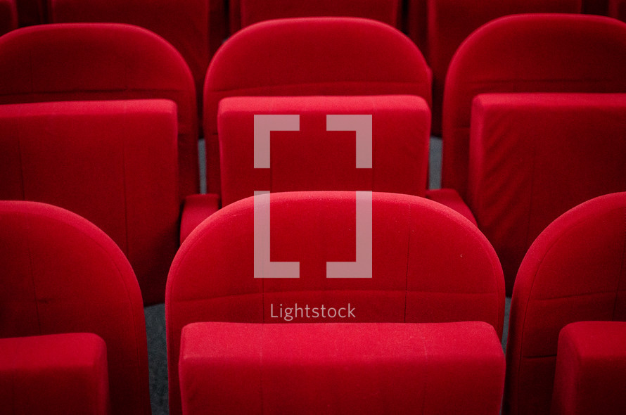 Plush red seats in a cinema autidtorium
