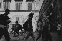 people walking in a courtyard in Italy 