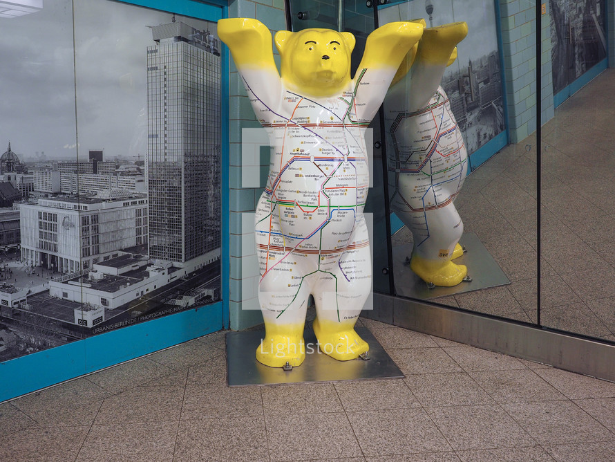 BERLIN, GERMANY - CIRCA JUNE 2019: bear, symbol of the city of Berlin, with U-bahn map