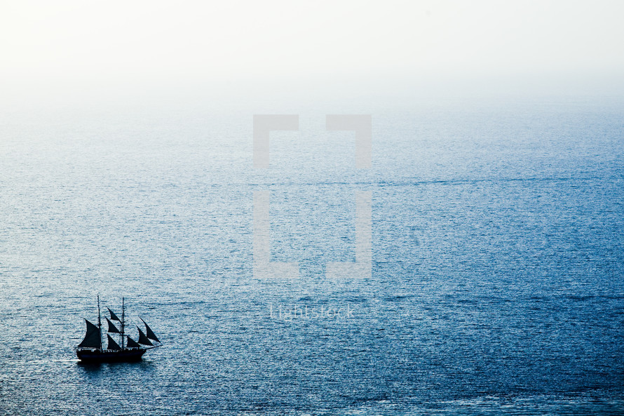 A ship sailing on a calm sea