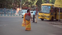 Hindu woman walking to the Birla Mandir Hindu temple in Kolkata, India.
