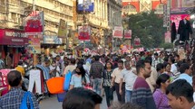 Busy markets and people on the sidewalks in Kolkata, India.