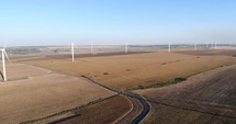 Drone Shot of Wind Turbine Generating Sustainable Energy At a Farm.