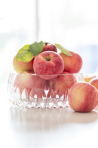 bowl of apples in natural light, backlit