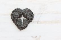 cross in heart shaped ashes 