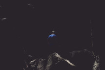 man in a dark cave