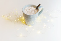 fairy lights and mug of hot cocoa 