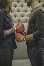 boxing couple touching gloves 
