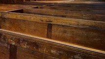 Worn pews in an old church building