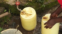 filling water jugs in Africa 