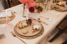 set table with candlesticks and flowers 