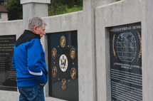 A man at a Veteran's Memorial 