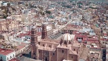 aerial view over a church and city in Mexico 