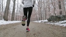 a woman running in winter 