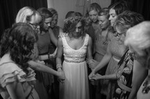 praying around a bride 