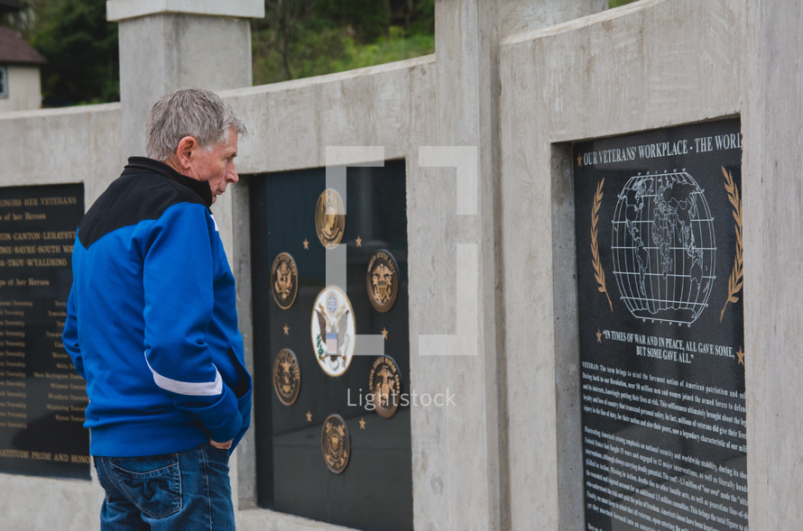 A man at a Veteran's Memorial 