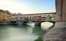 view of famous Ponte Vecchio with river Arno at sunset
