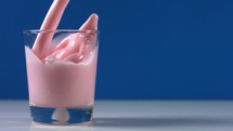 pouring strawberry milk
