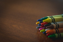crayons on wood table 