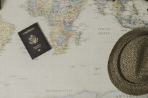 passport and hat on a map, missions preparation 