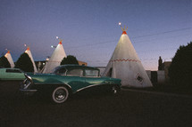 vintage cars and tepee motel rooms