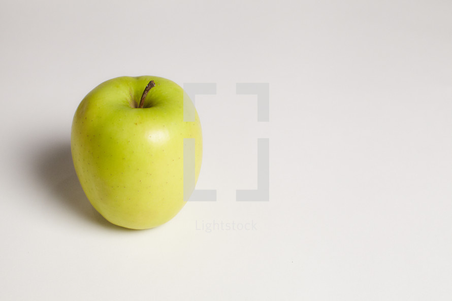 A green apple isolated on white
