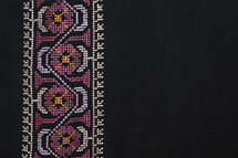 Close up of pattern on woman's robe from the Middle East