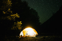 stars in a night sky over a tent 