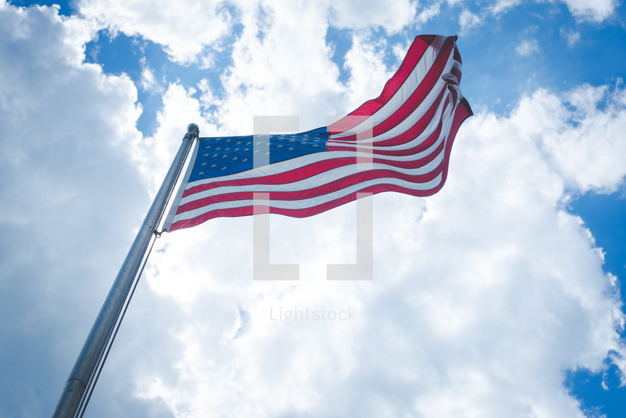 waving American flag on a flagpole 