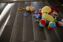 toddler toys on a wood floor 