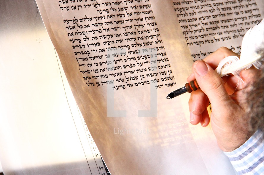 A Rabbi hand-writing the Torah