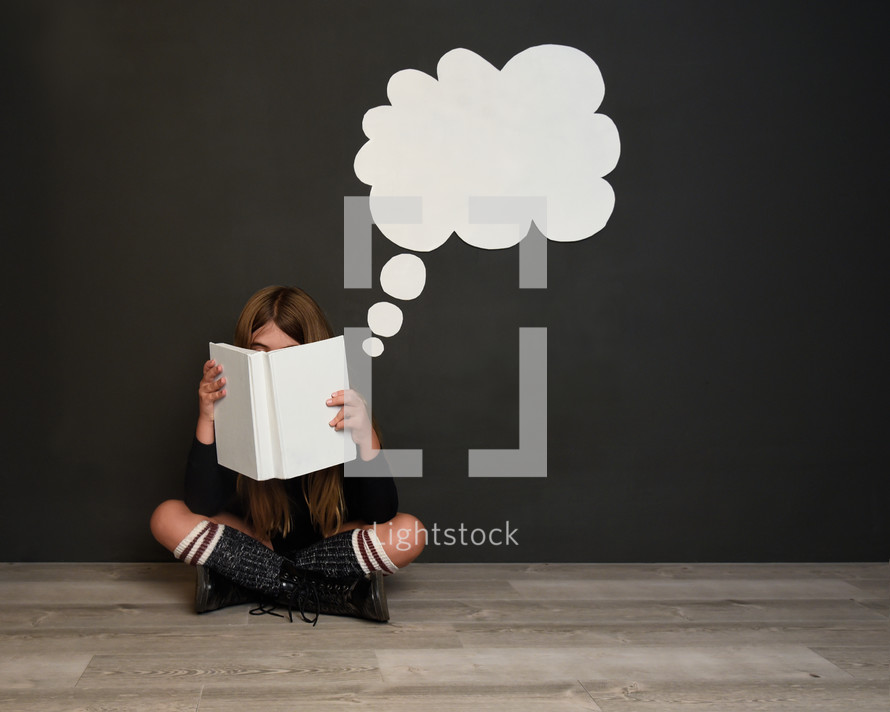 a child reading a book 