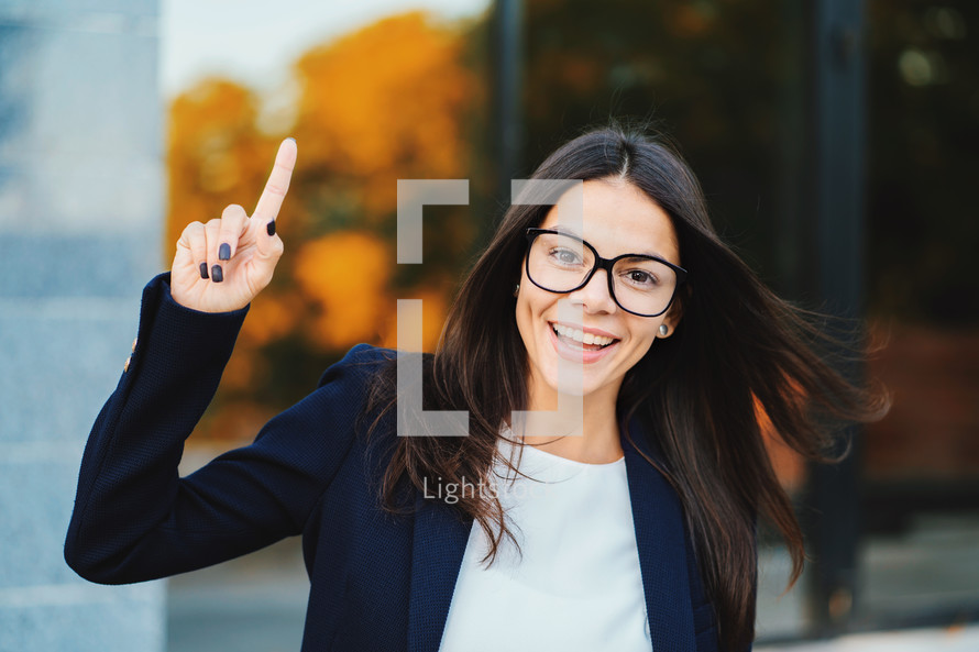 Smiling Happy Student Girl Showing Eureka Gesture. Portrait Of Young Thinking