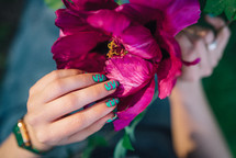 Creative vibrant pink nails art design, animalistic zebra pattern. Fuchsia color. Beautiful peony flower. High quality photo