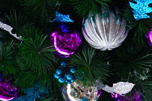 fuchsia, blue and silver ornaments on a Christmas tree