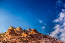 red rock cliff and blue sky