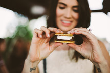 a woman eating a s'more 