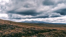 Dramatic grey storm clouds Time lapse over Mount Ruapehu volcanic mountains in wild New Zealand nature
