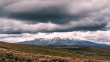 Dark dramatic clouds over Mount Ruapehu volcano mountain in wild nature of New Zealand landscape time lapse
