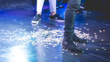 feet standing on a stage 