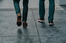 pedestrians walking on a sidewalk 