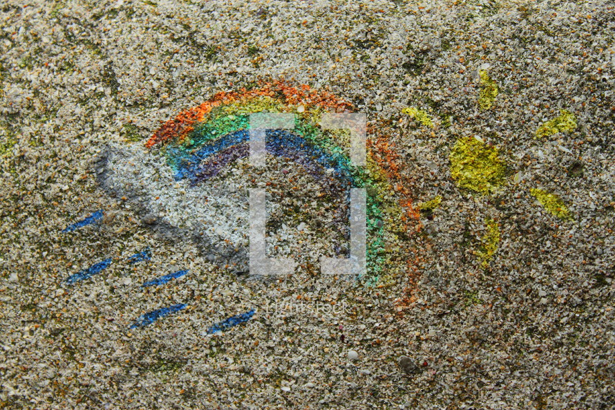 Rainbow and sun chalk art.