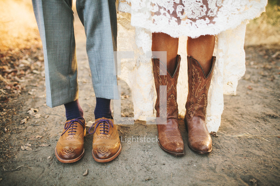 shoes and cowboy boots of a man and woman 