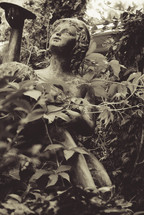 Garden statue of a little girl.