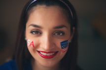 woman with a painted face for July 4th 