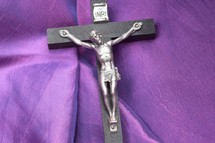 crucifix on purple fabric for Lent 