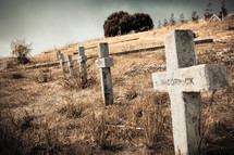 Cross headstones on hillside cemetary.