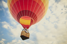 A couple riding in a hot air balloon