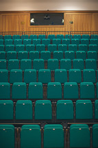 rows of seats in an empty auditorium